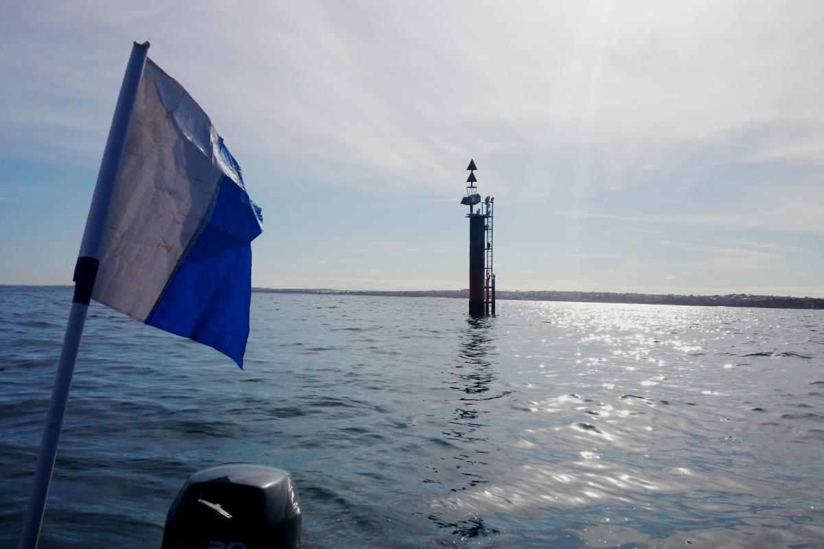 Dive flag on boat near north lump marker