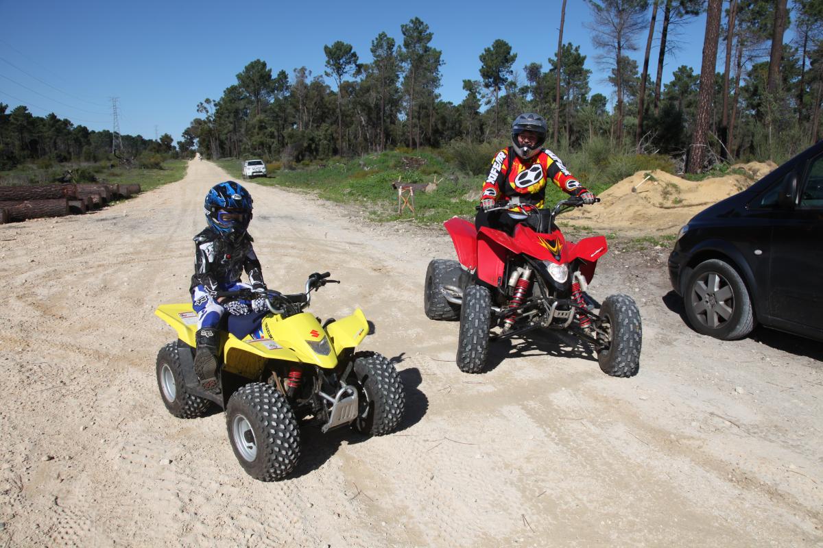 two riders on quad motorbike ready to ride