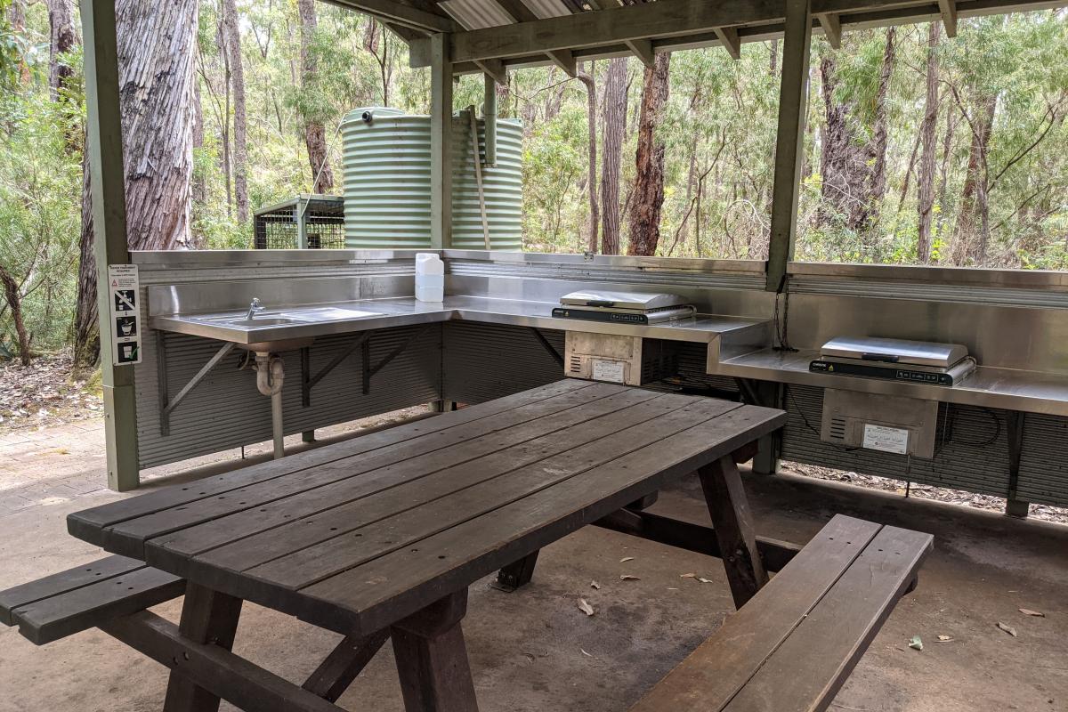 Sues Bridge Campground picnic shelter with sink and BBQ