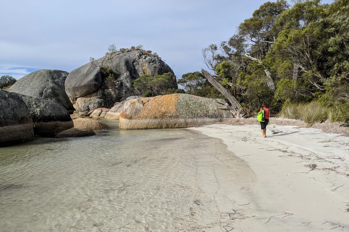 Person walking on Two Peoples Bay Beach