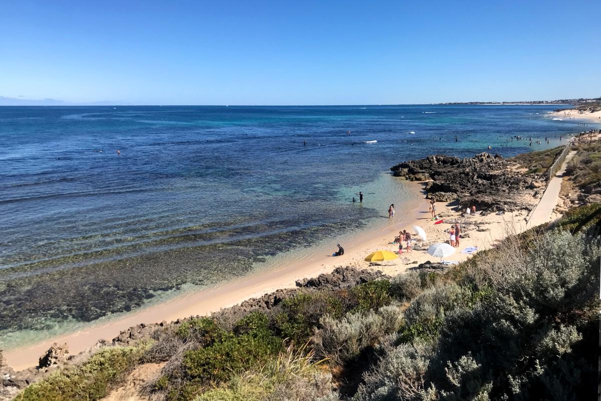 Swimmers and snorkellers enjoying the reef at Mettams Pool 