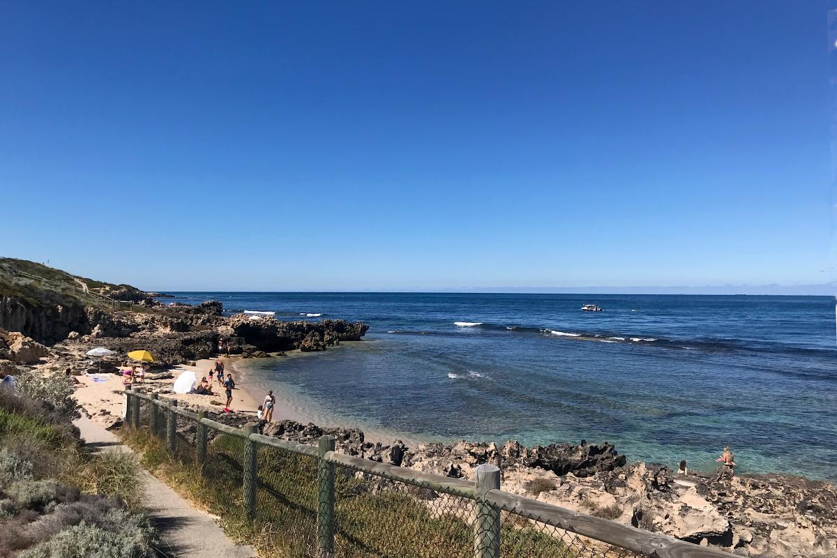 A calm day at Mettam's Pool Sloping walkway leading down to a calm ocean reef at Mettam's Pool