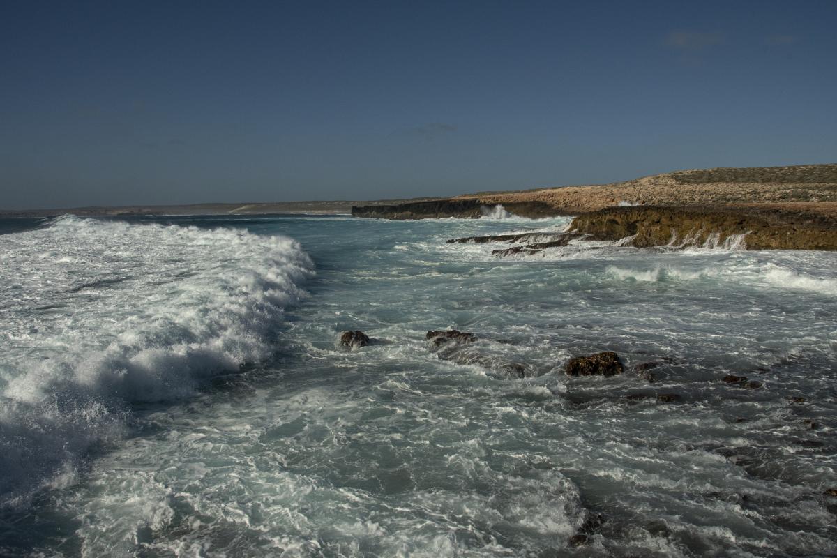 Waves crashing onto the rocky coastline at Quoin Head