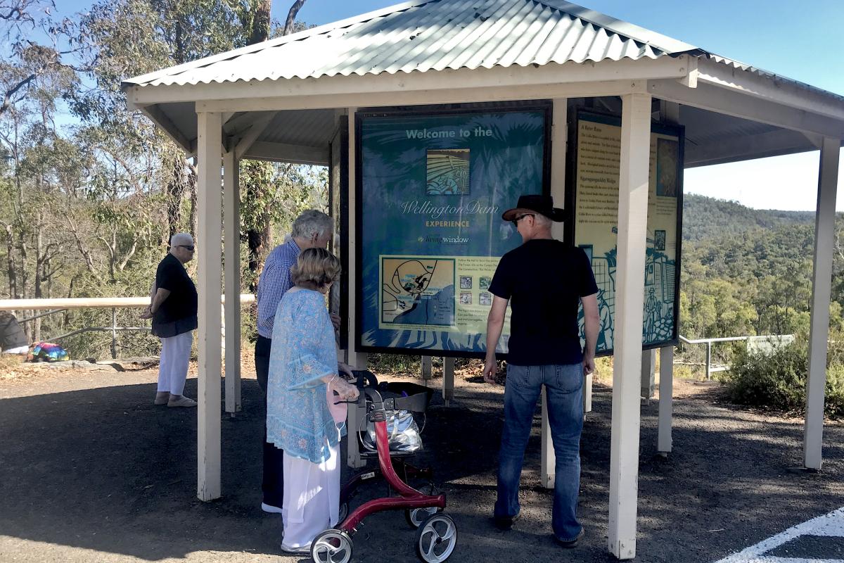 People reading the interpretive panels at Wellington Dam Lookout