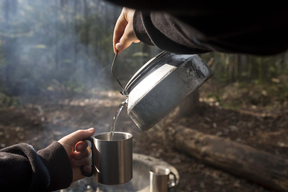Pouring hot water into a camping cup