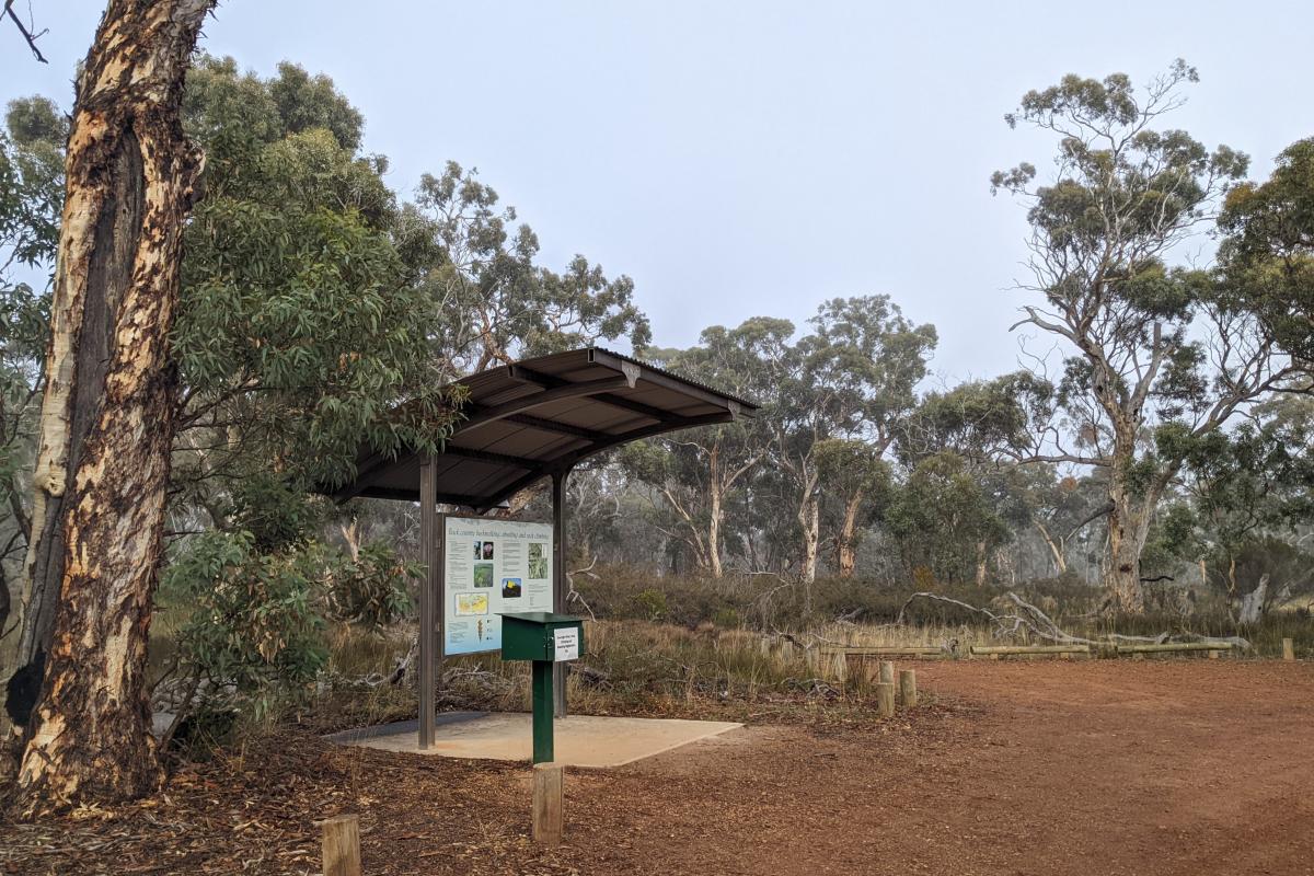 Registration point, information sign, and parking for Bluff Knoll Picnic Area