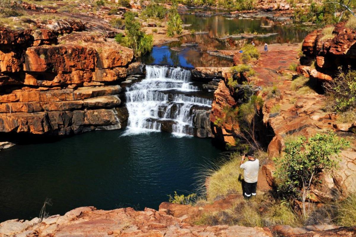 Person looking at Bell Gorge Falls.