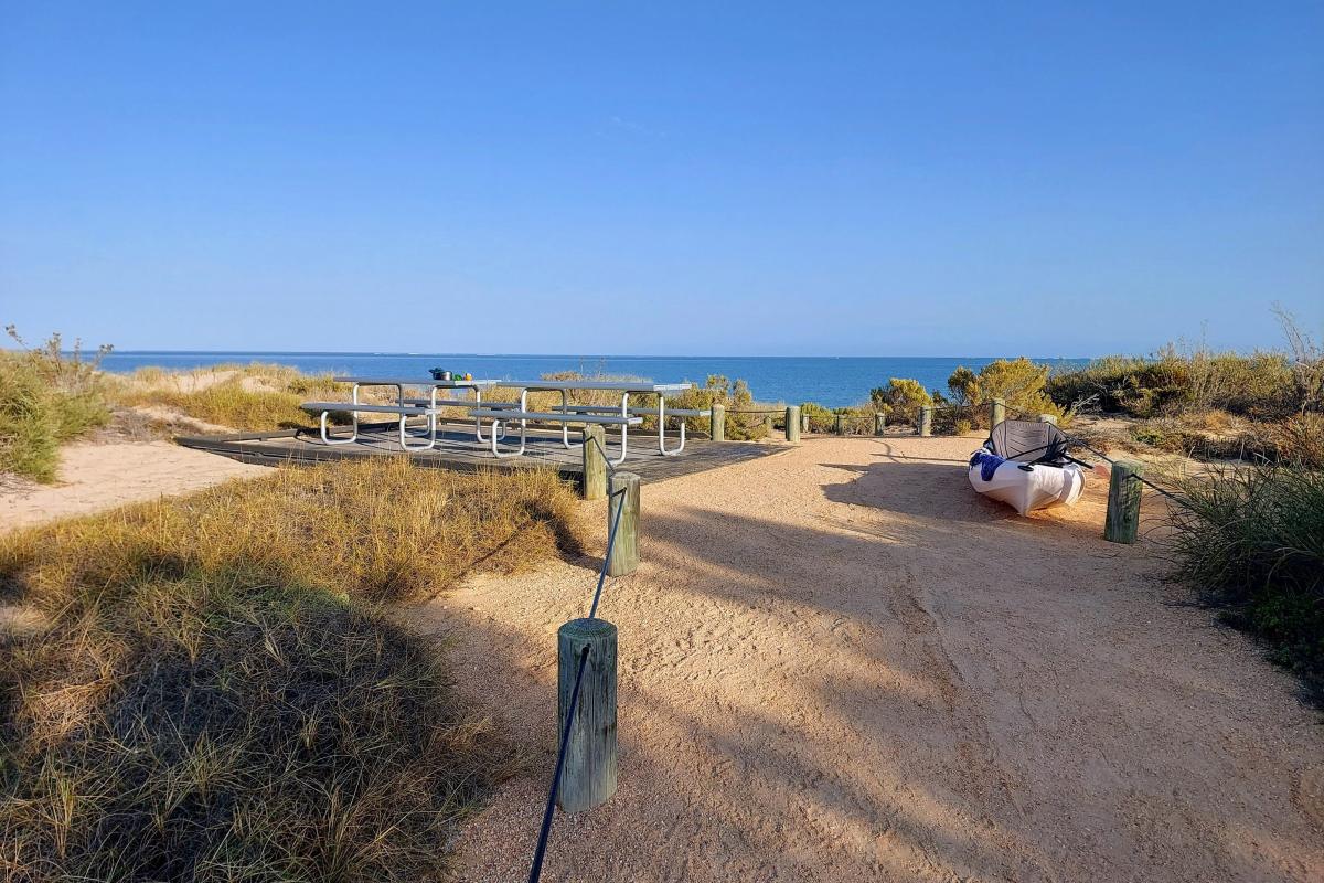 Beach access path and communal picnic tables at Yardie Creek Campground Beach access path and communal picnic tables at Yardie Creek Campground