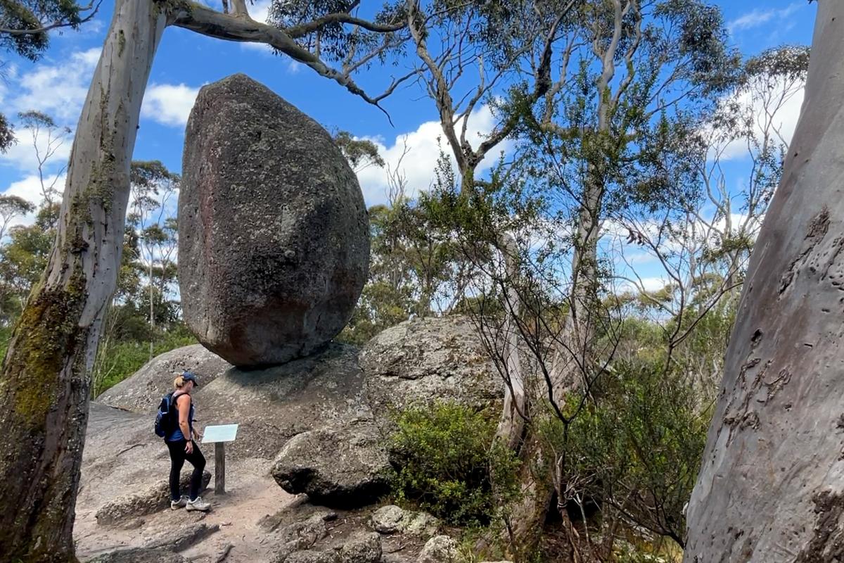 Balancing rock Large granite rock that appears to be balancing on a smaller rock.