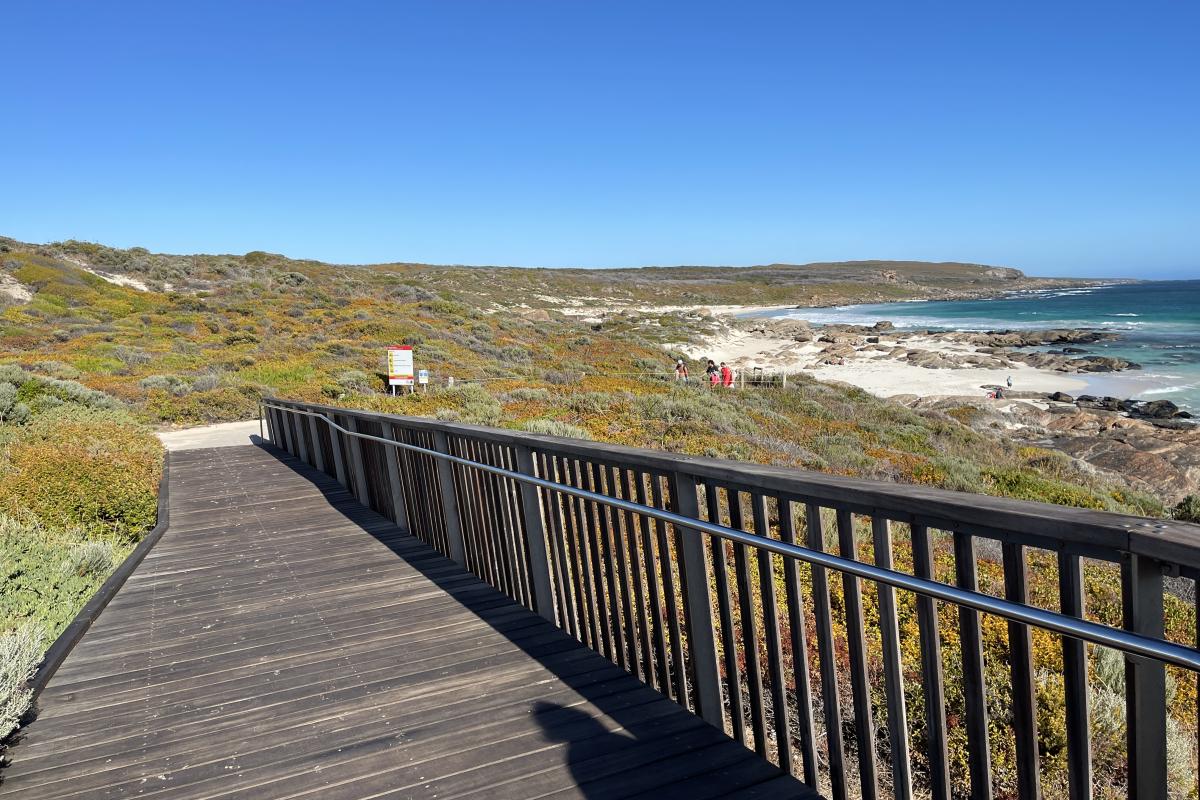 Wood ramp leading down to beach. 