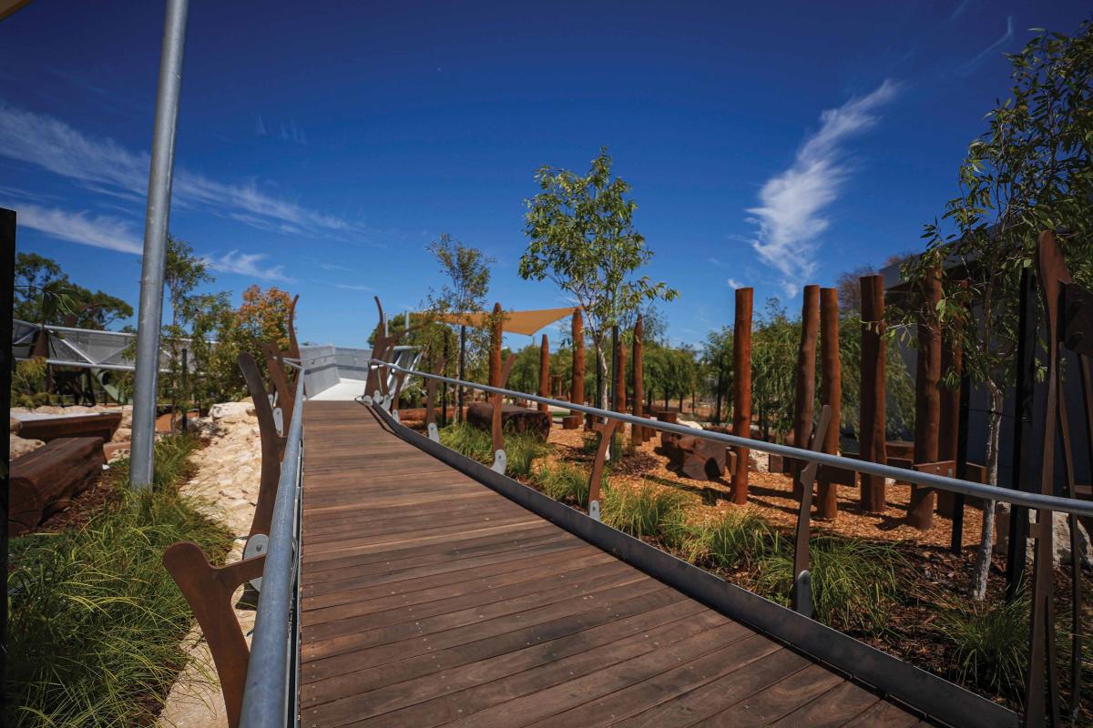 Wooden boardwalk in playground. 