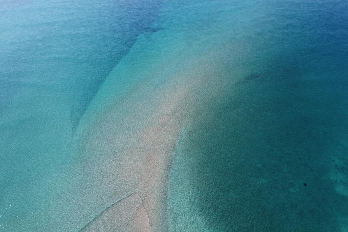 Aerial view of clear blue water. 