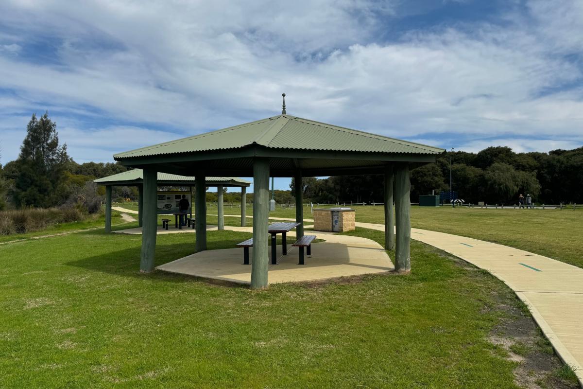 Picnic tables under shelters at Lake Richmond