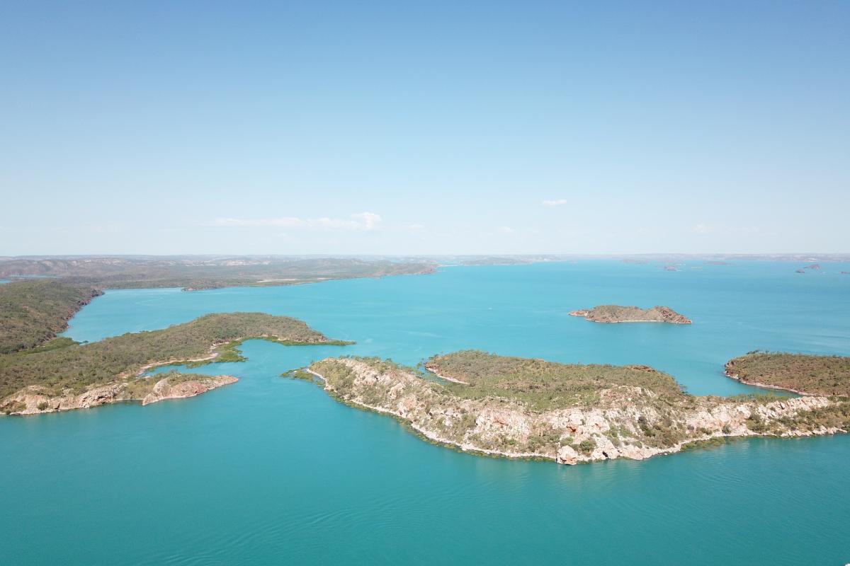 Aerial view of islands and green ocean. 