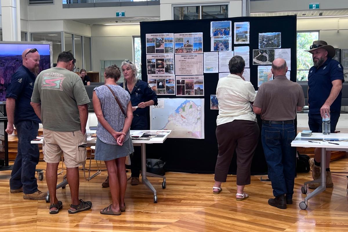 People standing near display boards. 