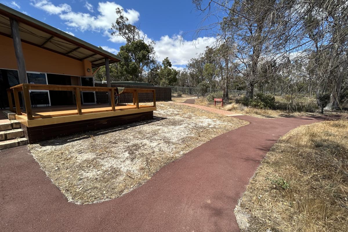 Concrete paths at the back of the building. 