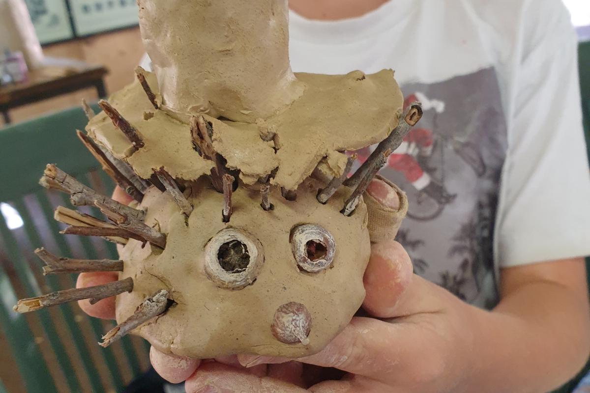 Clay and sticks in the shape of an echidna. 