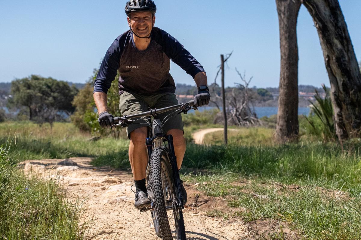 Person riding bike on trails. 