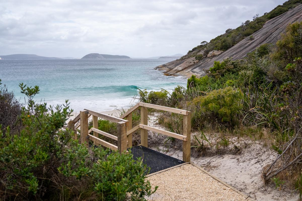 Platform leading to steps down to a beach. 