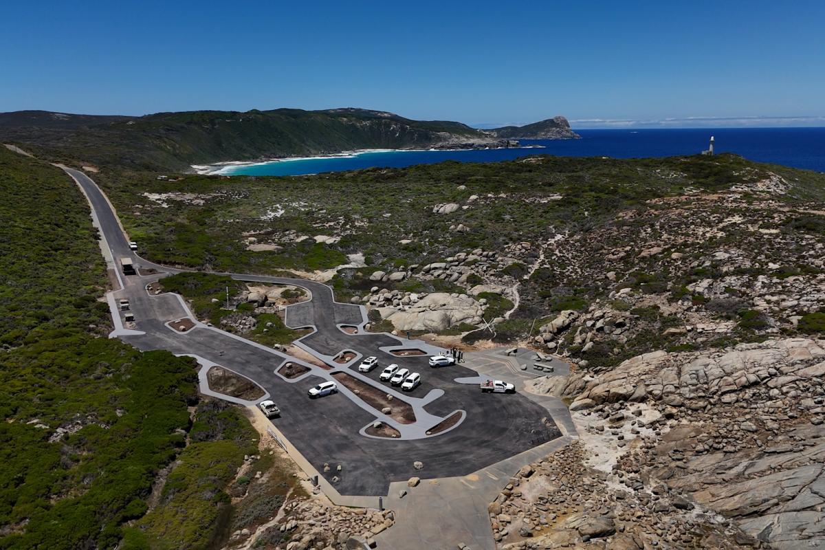 Aerial view of large parking area.