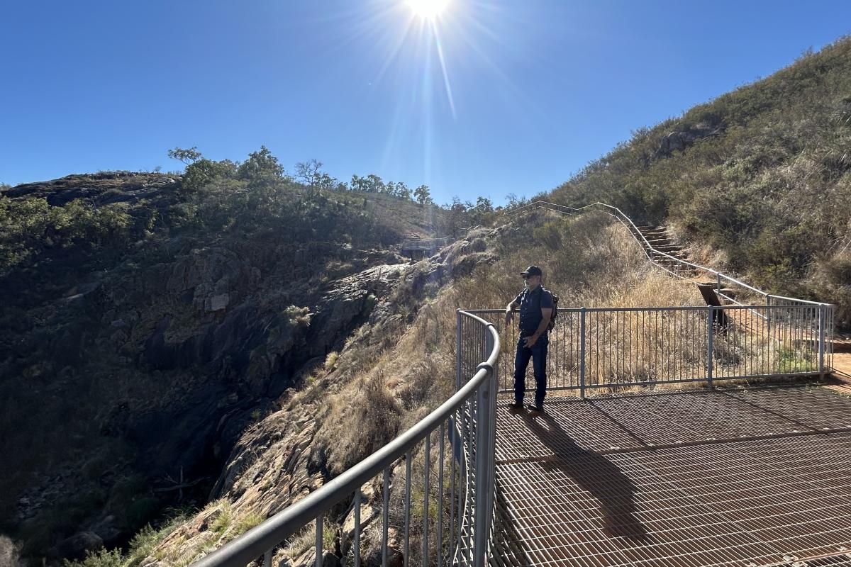 Lesmurdie Falls Person standing on a lookout.