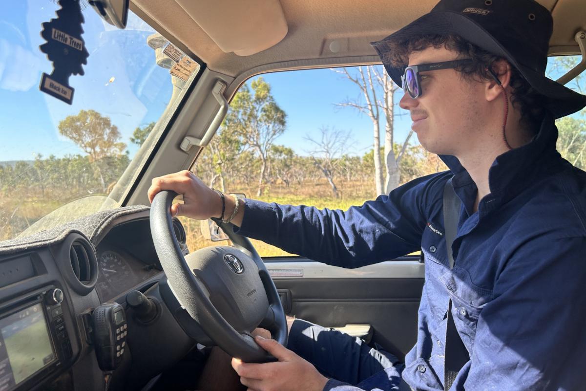 Side view of person driving a car. 