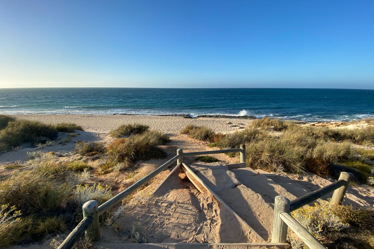 Sandy path down to a beach. 