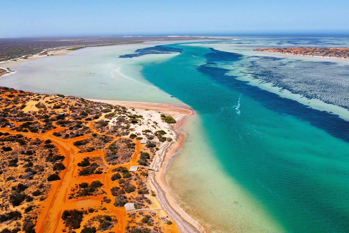 Aerial view of campground next to the ocean. 