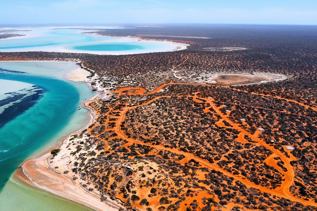 Aerial view of campground next to the ocean. 