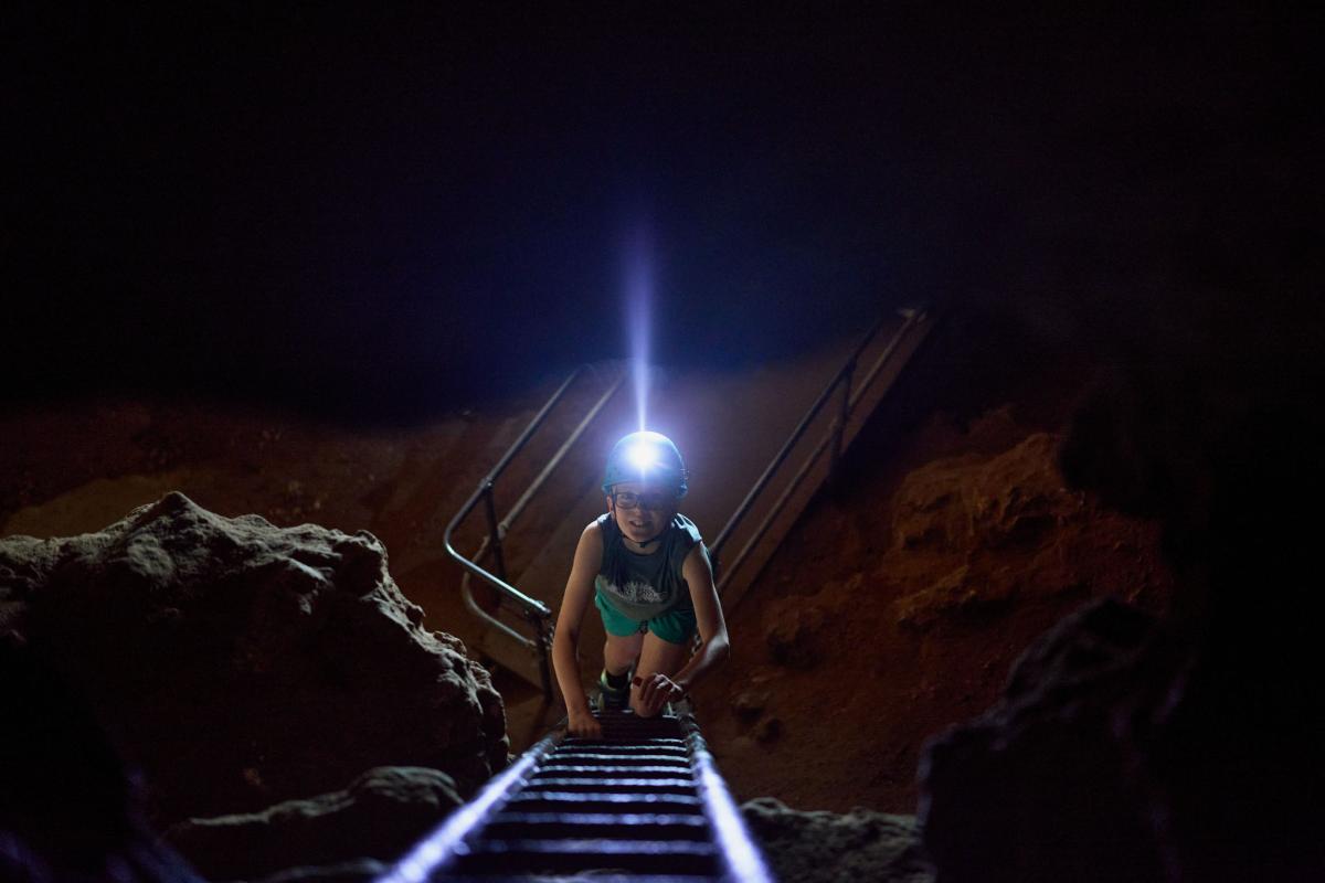 Boy climbing ladder 