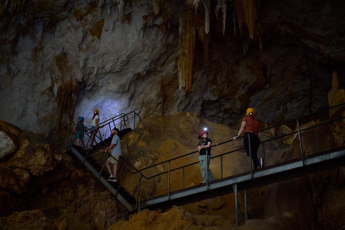 People standing on elevated boardwalk in Giants Cave