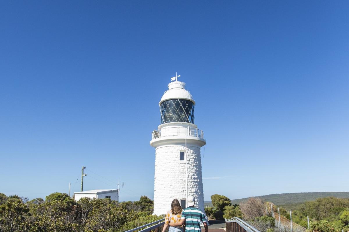 Visitors walking towards Cape Naturaliste Lighthouse. 