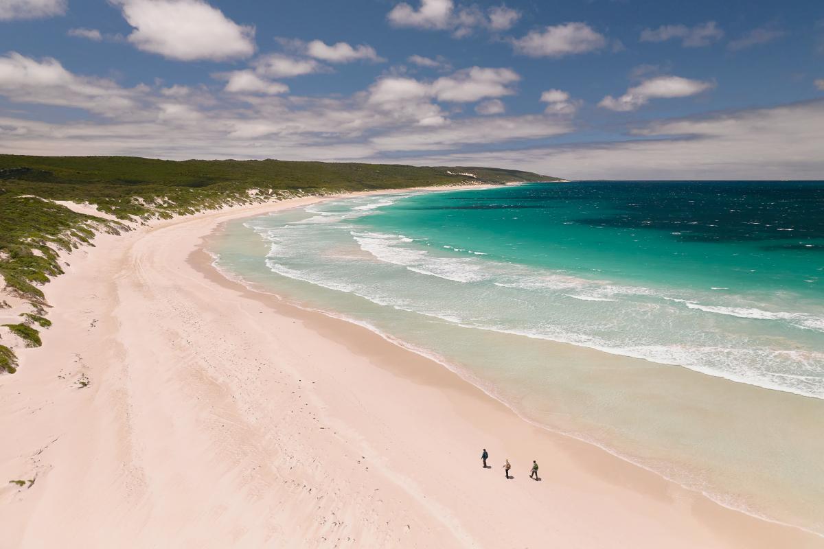 Aerial image of hikers on Deepdene Beach. 