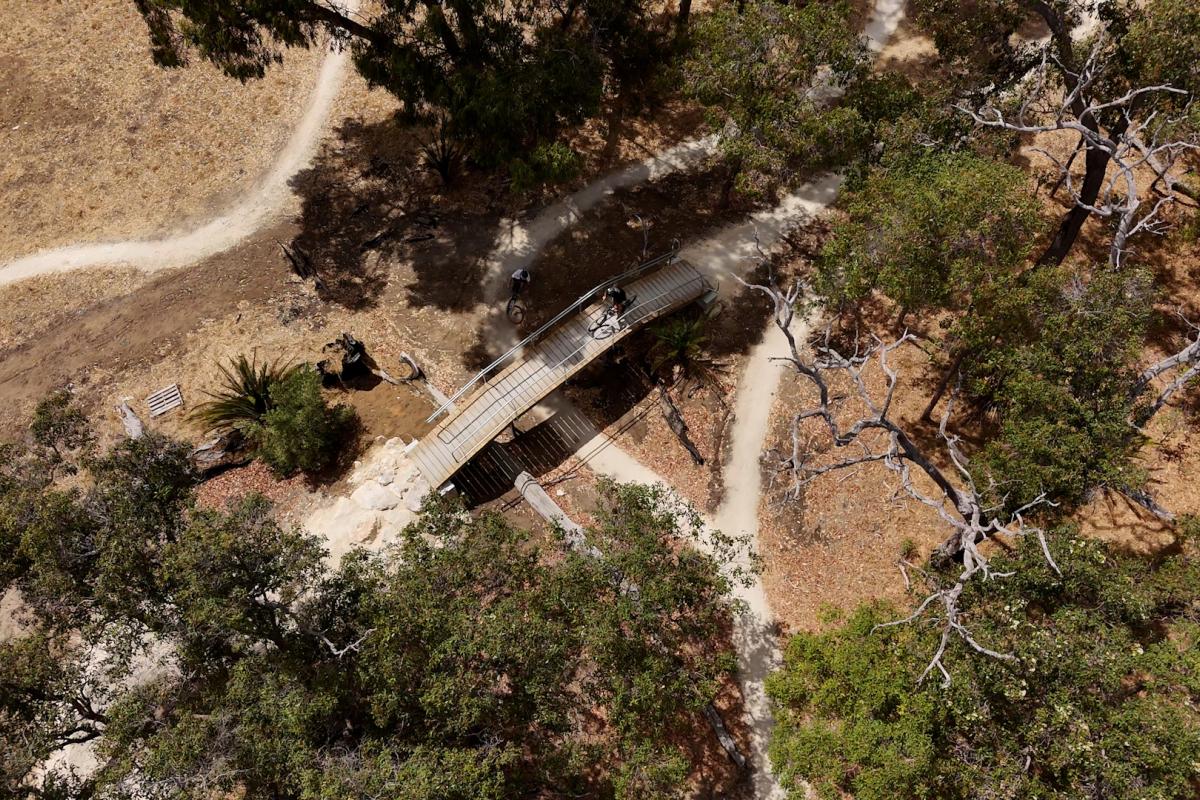 Aerial view of bridge over mountain bike trails. 