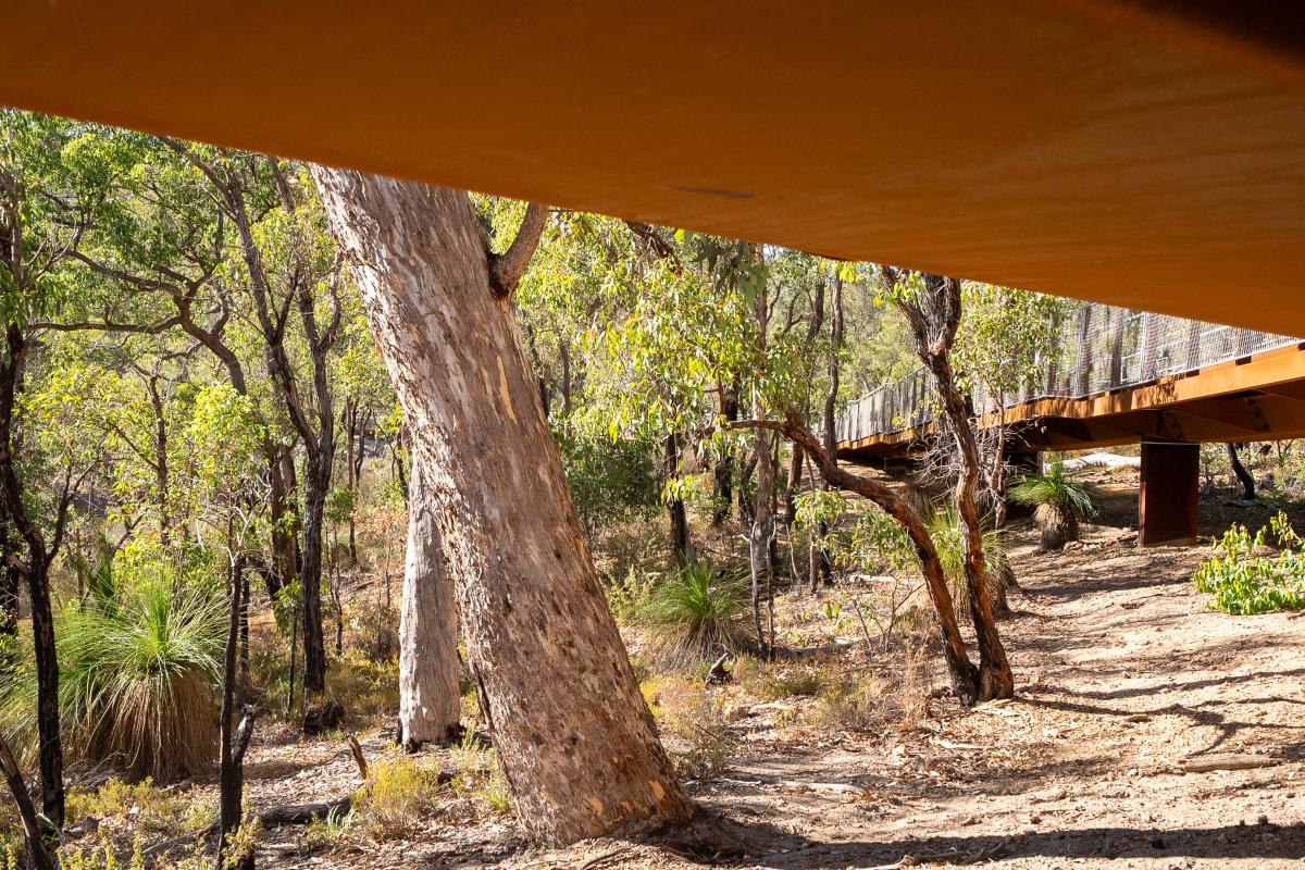 The metal support on underside of the walkway.