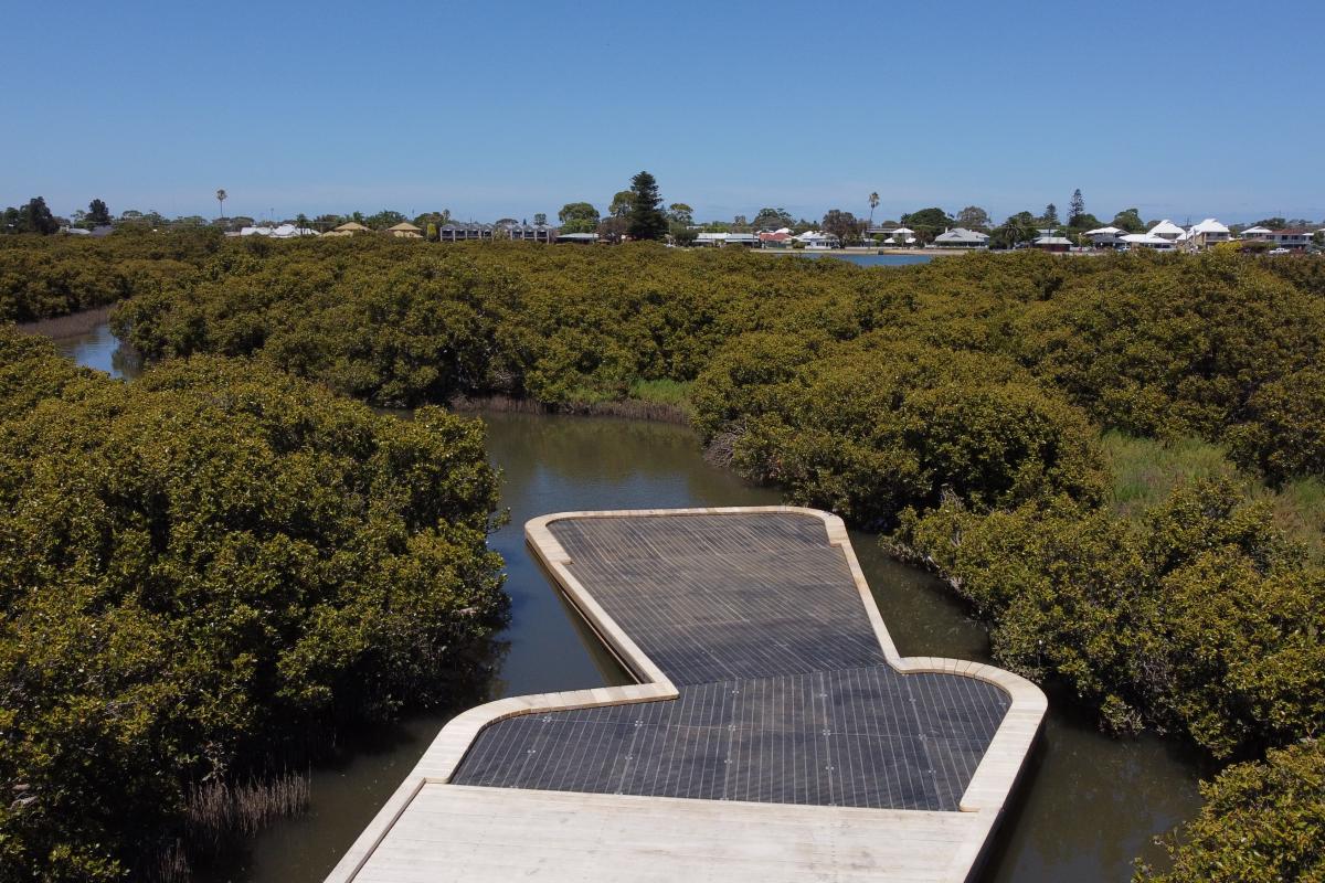 View of boardwalk over water.