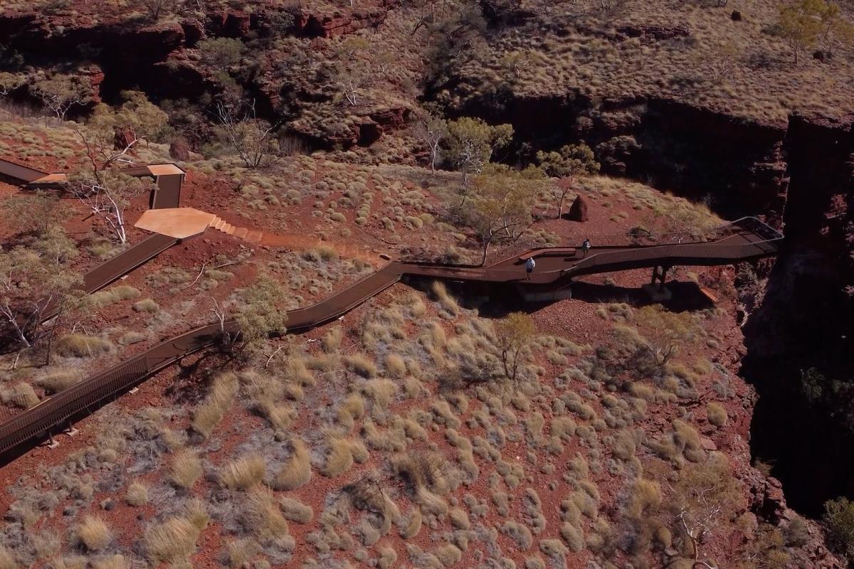 Aerial view of boardwalks leading to a lookout over a gorge. 
